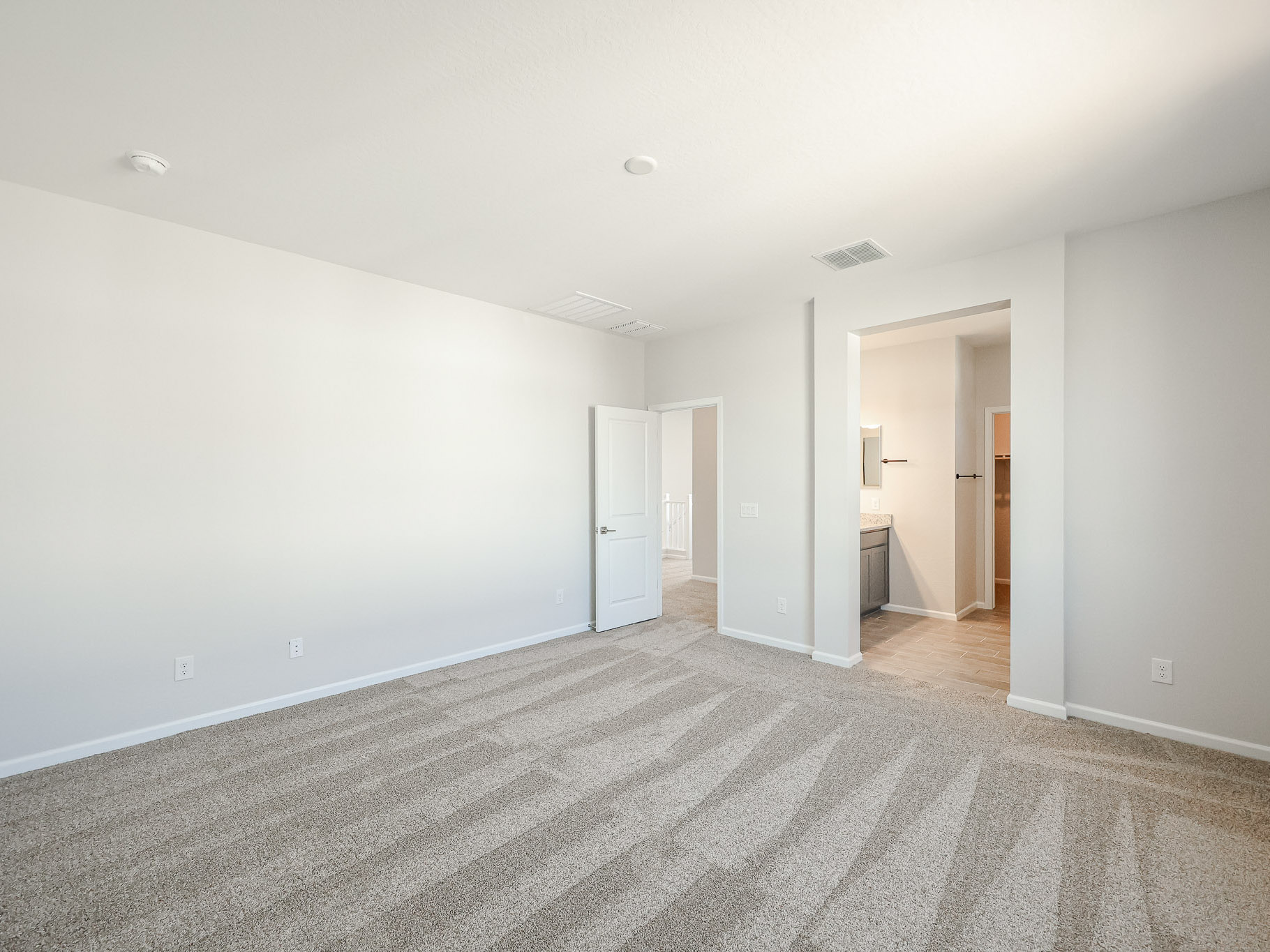 A long hallway with white walls.