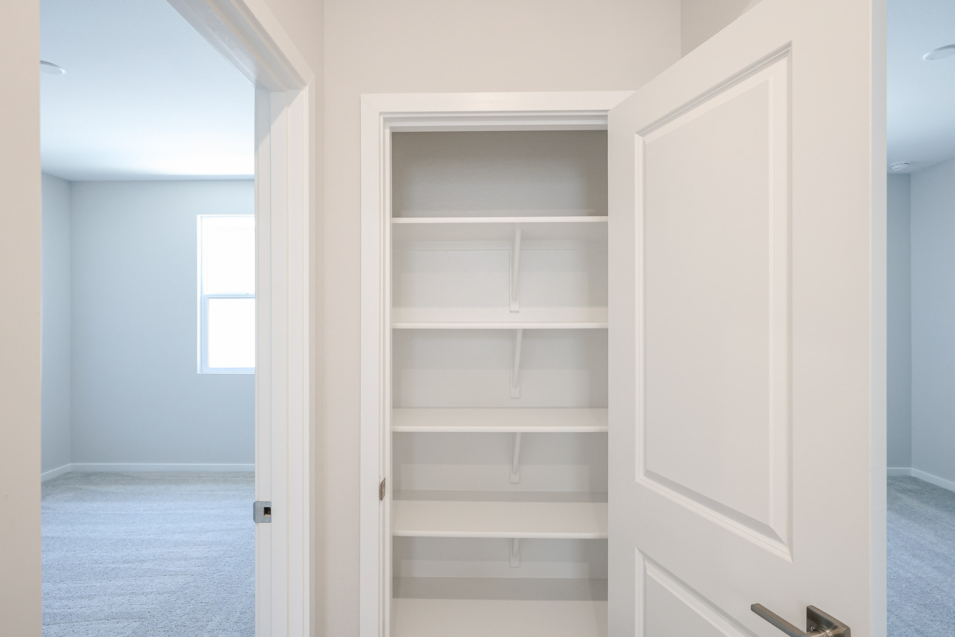 A white cabinet in a room.