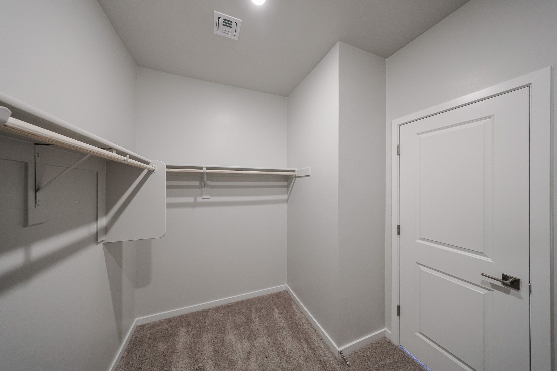 A bathroom with white walls.