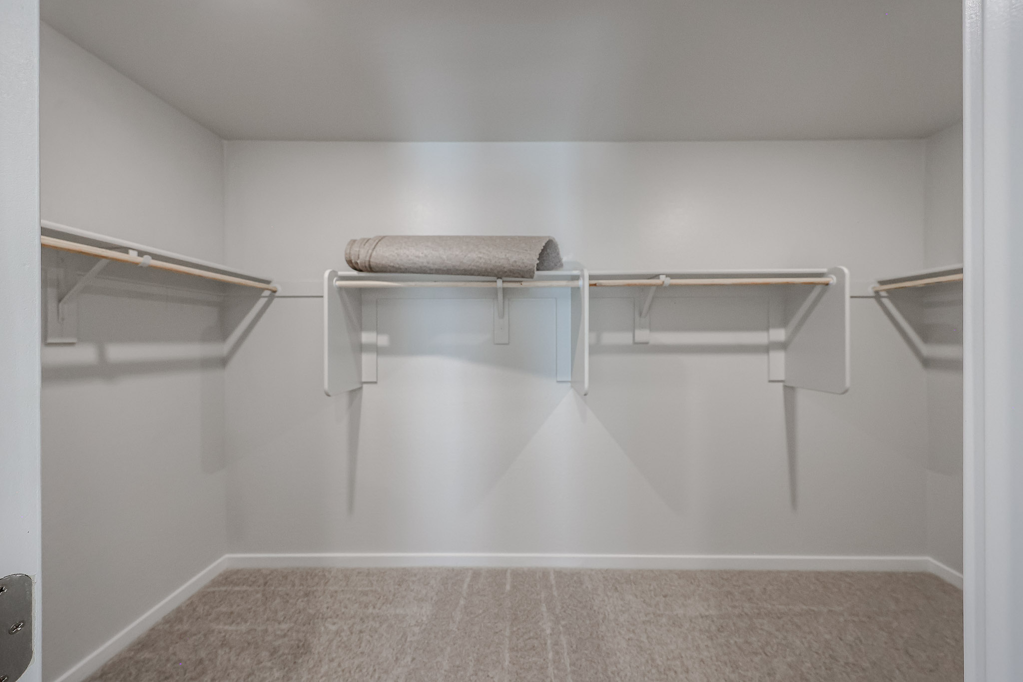 A white room with a grey floor.