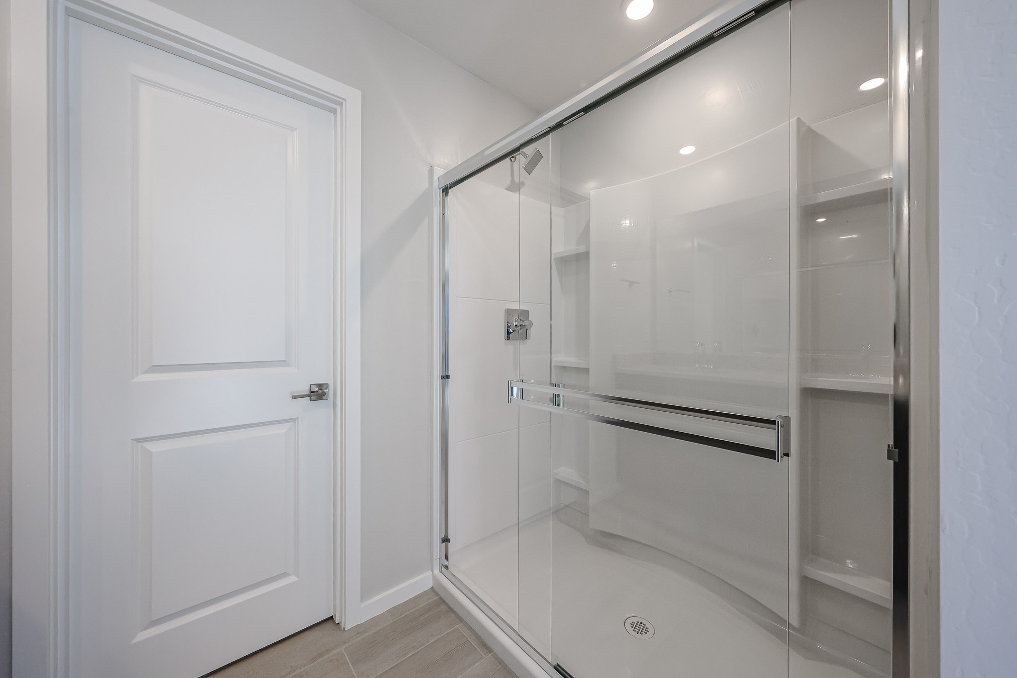 A shower unit in a bathroom.