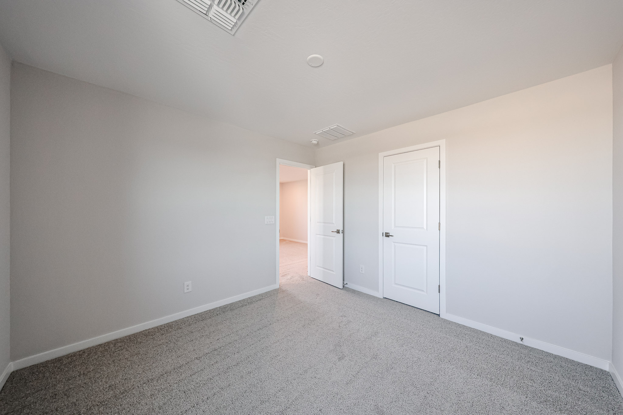 A room with white doors.
