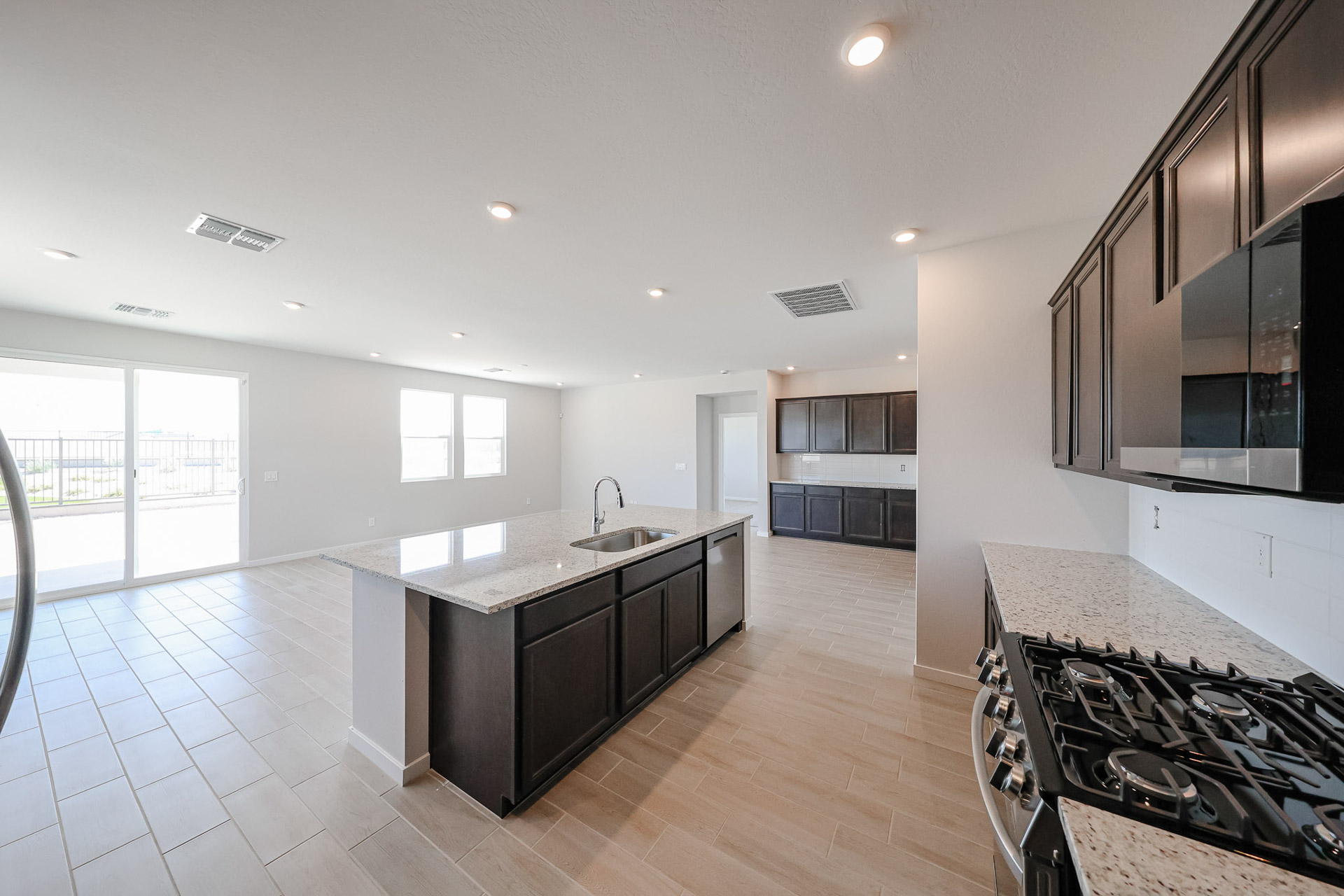 A kitchen with black appliances.