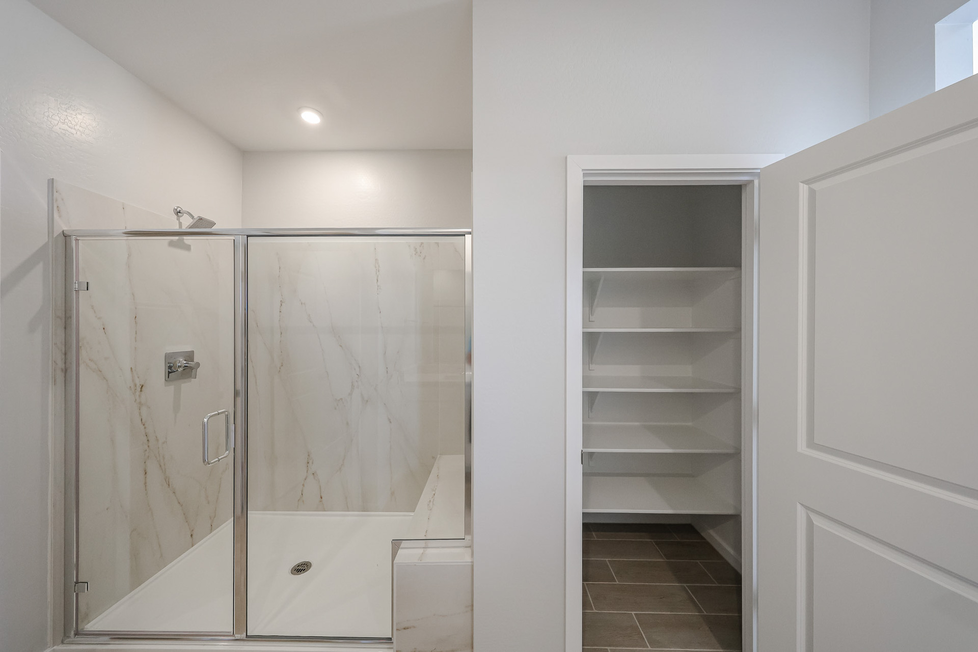 A bathroom with a glass shower.