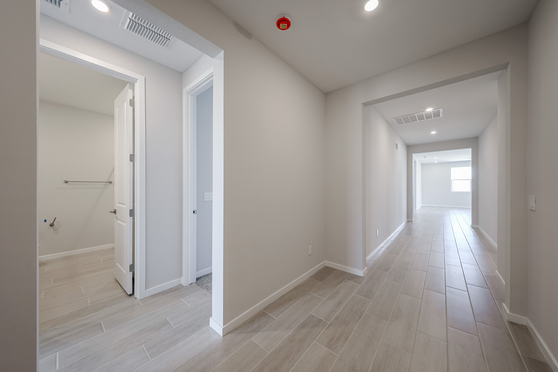 A hallway with white walls.