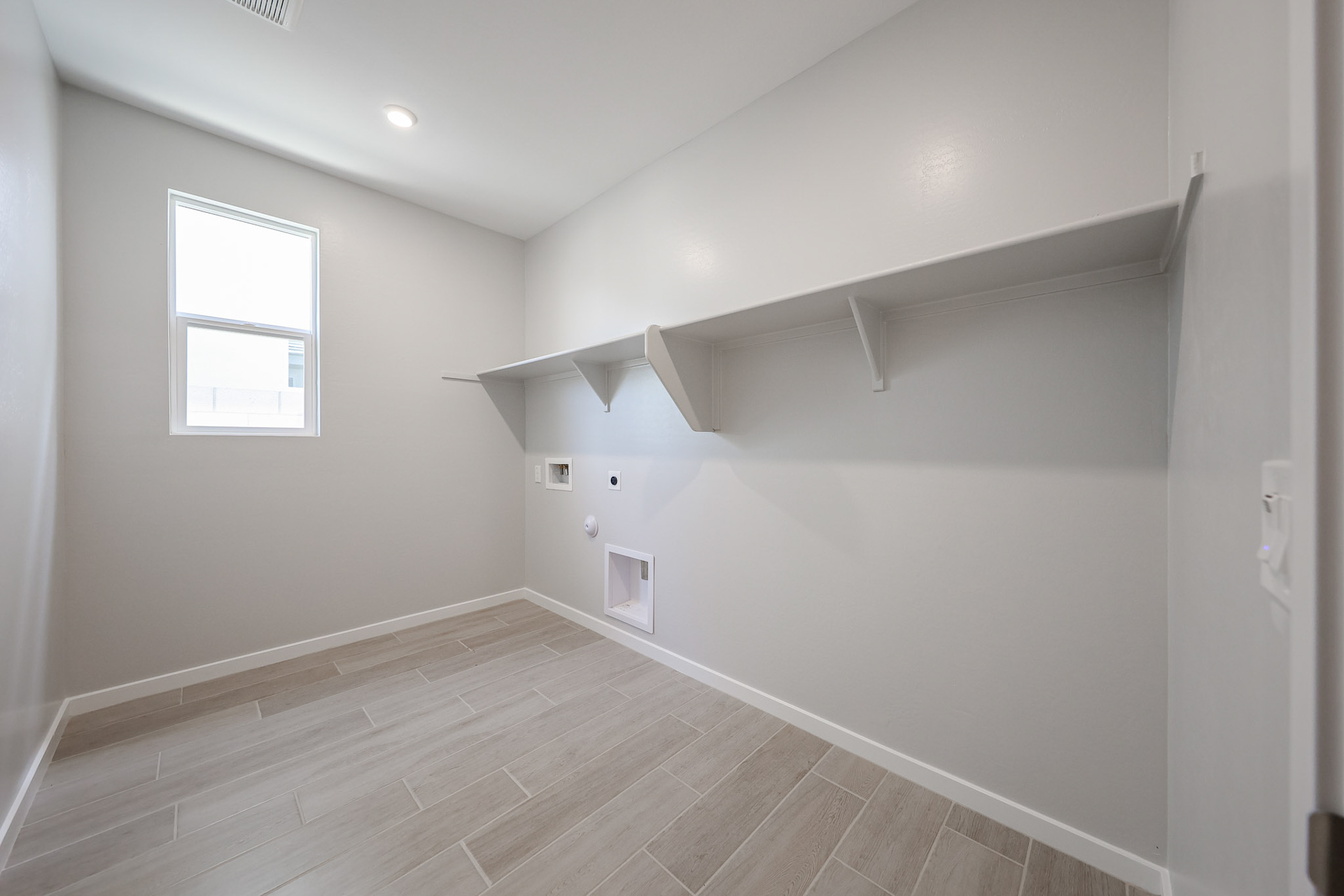 A room with a wood floor and a wood floor.