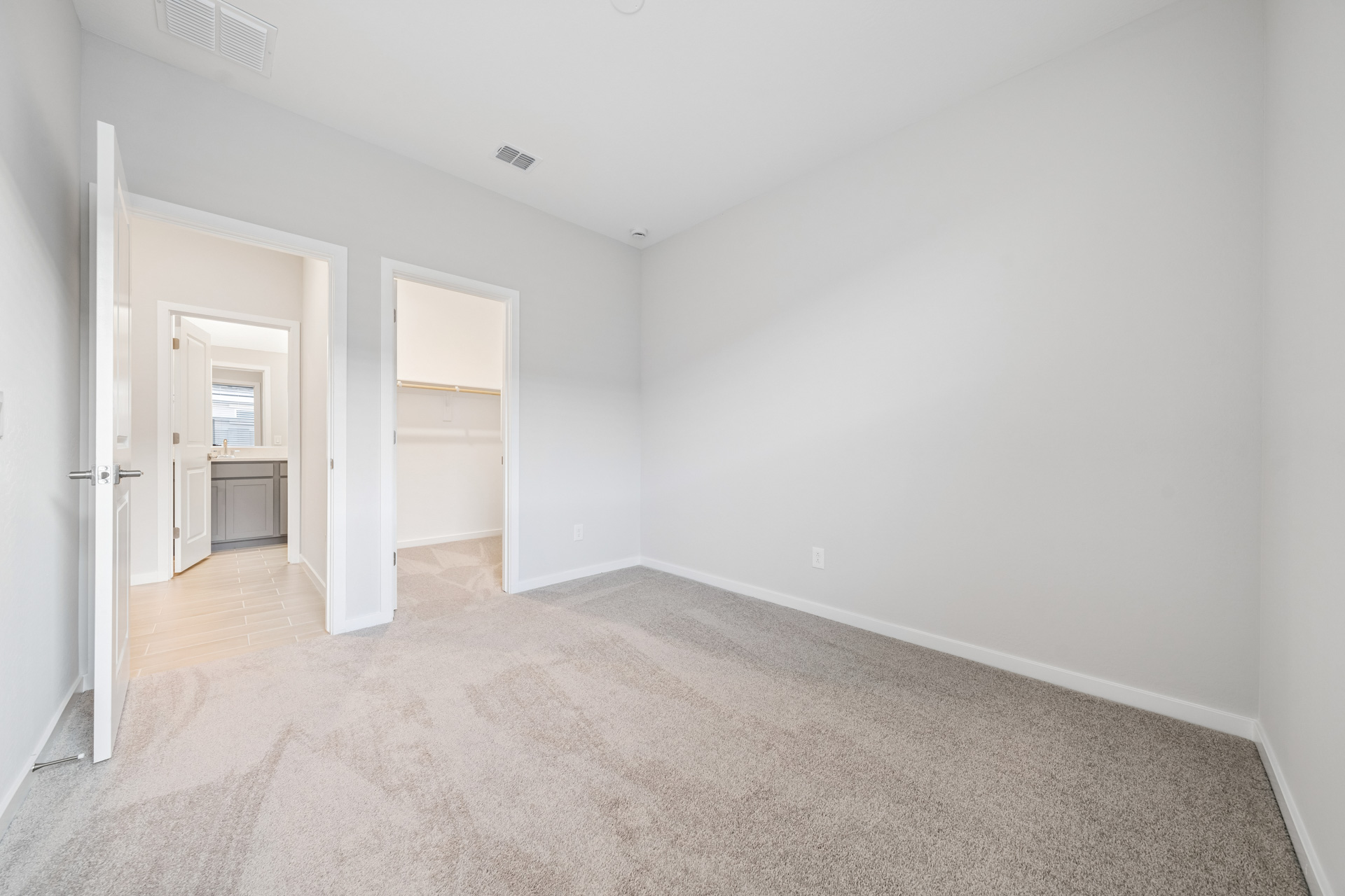 A hallway with white walls.