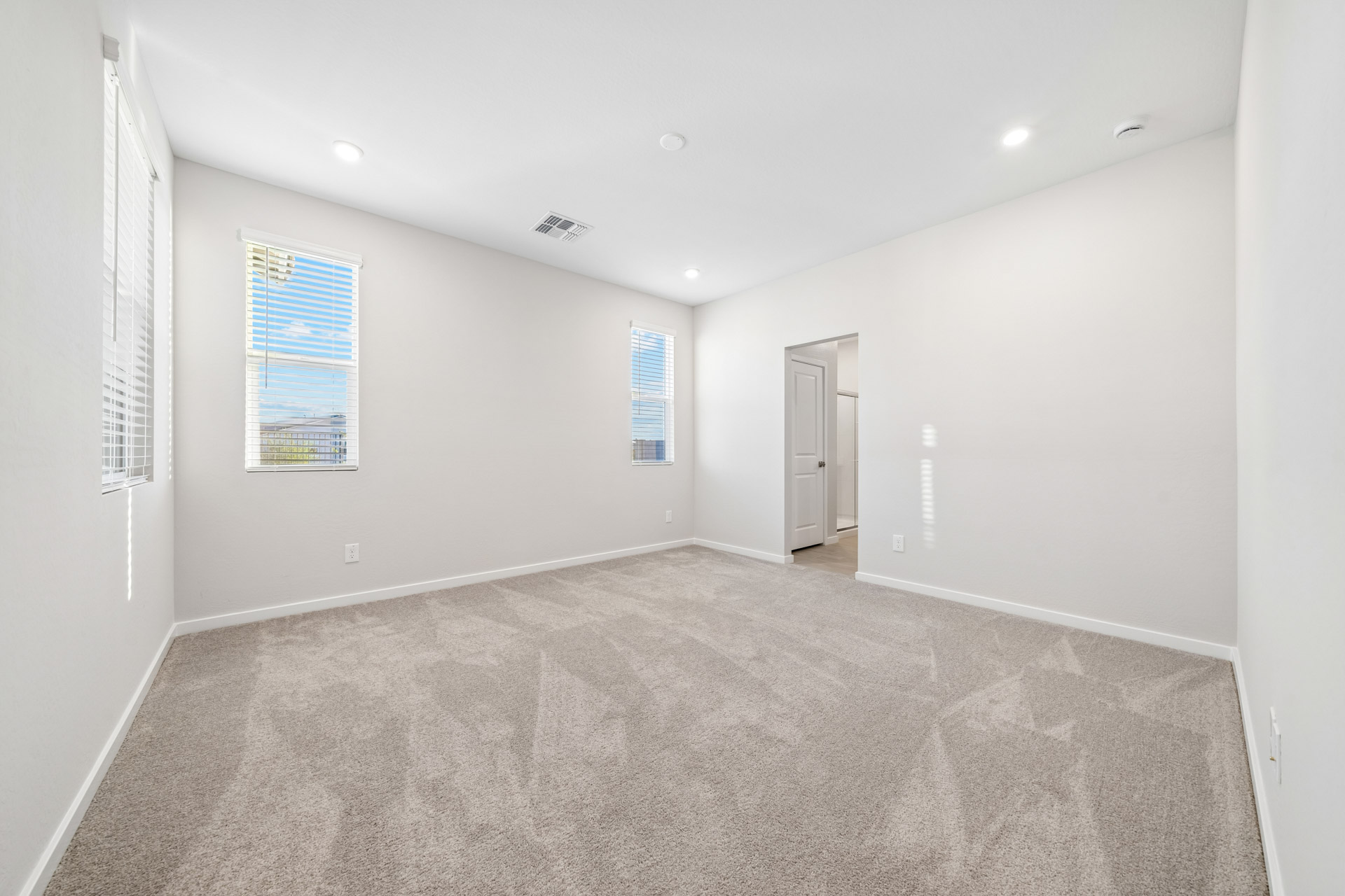 A hallway with a carpet.