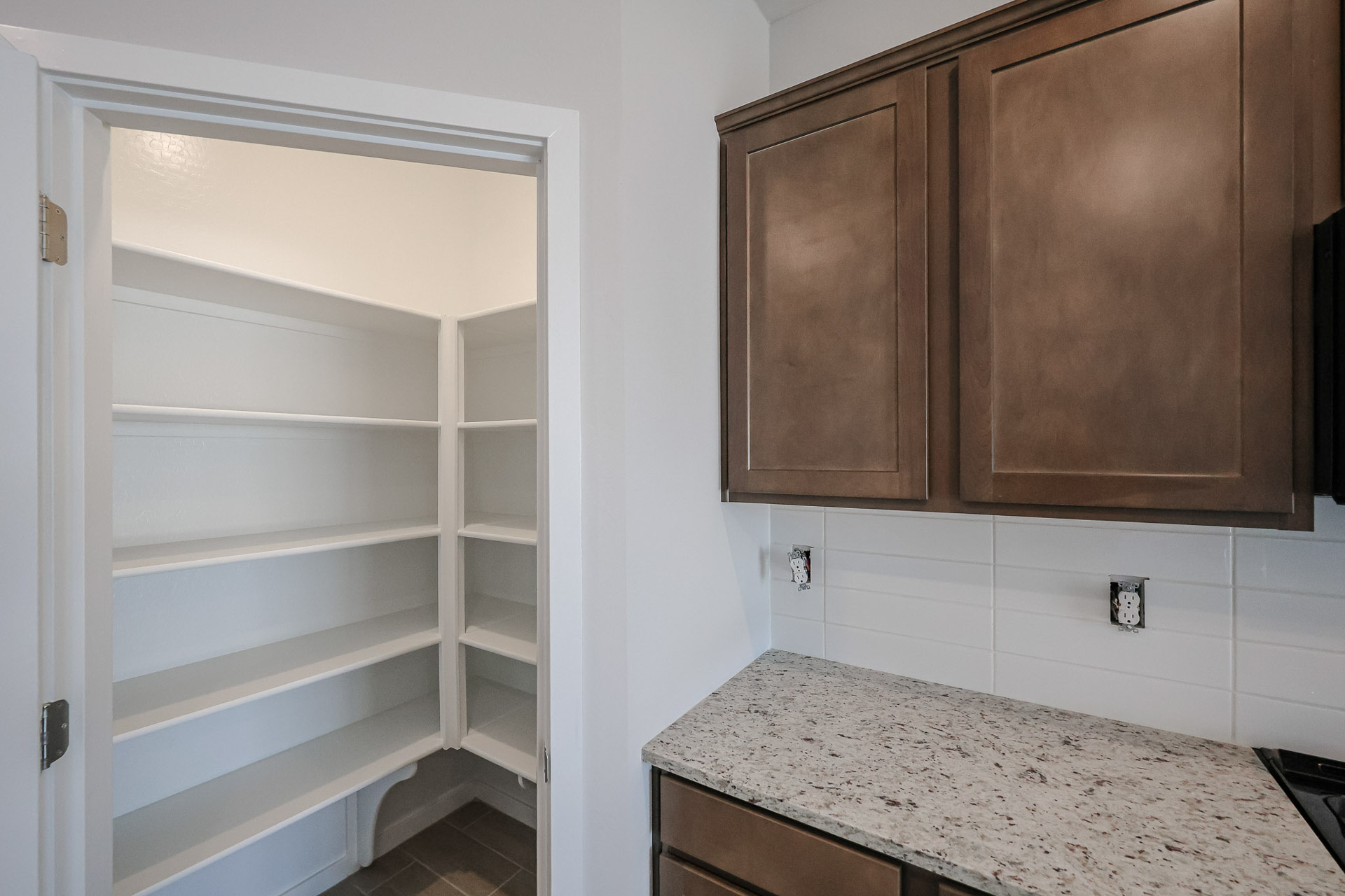 A kitchen with a countertop and cabinets.