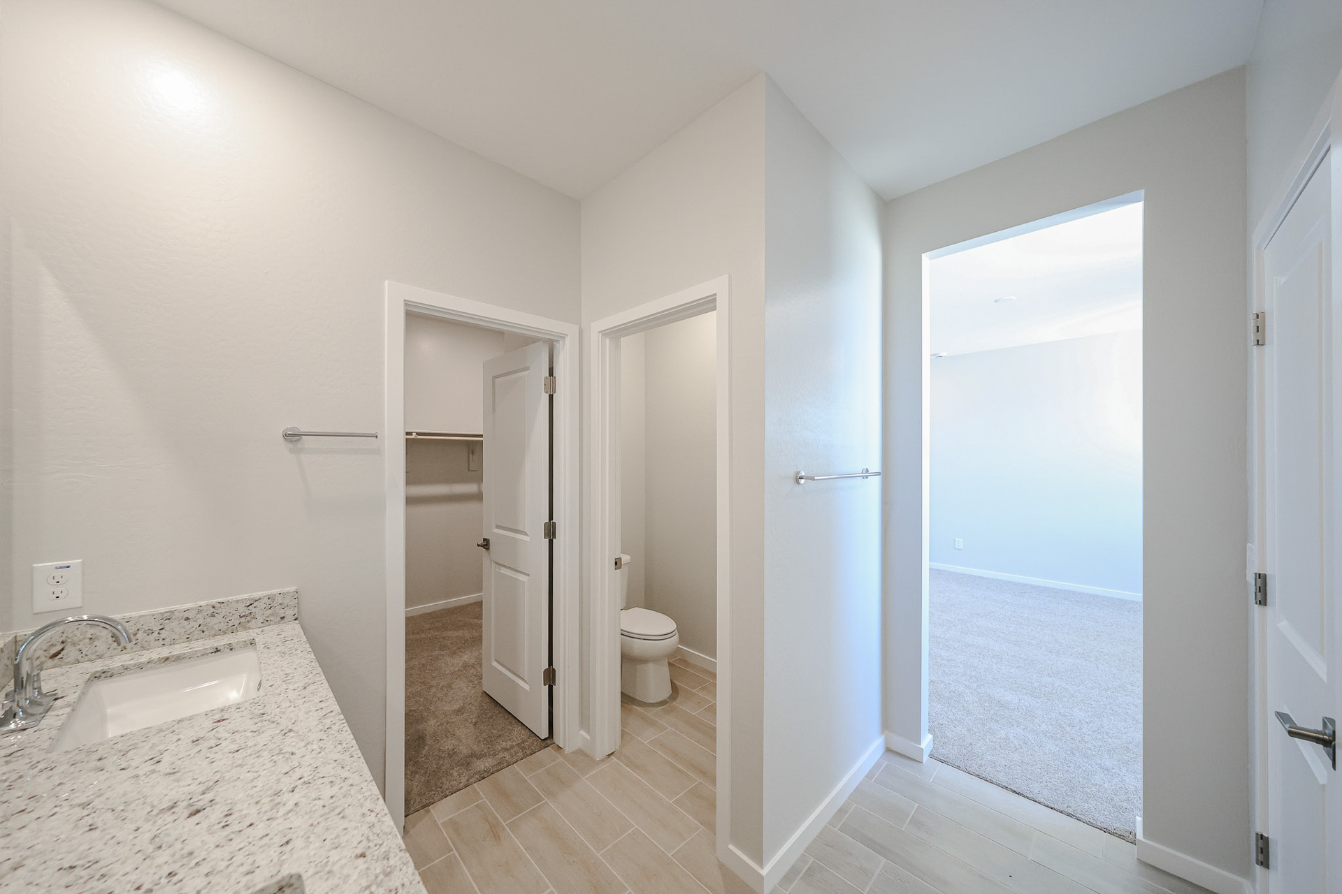 A bathroom with a sink and shower.