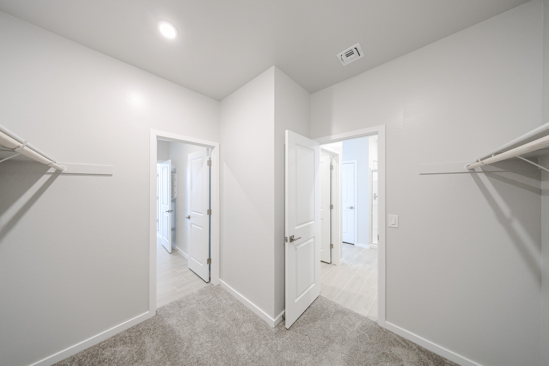 A hallway with white walls.