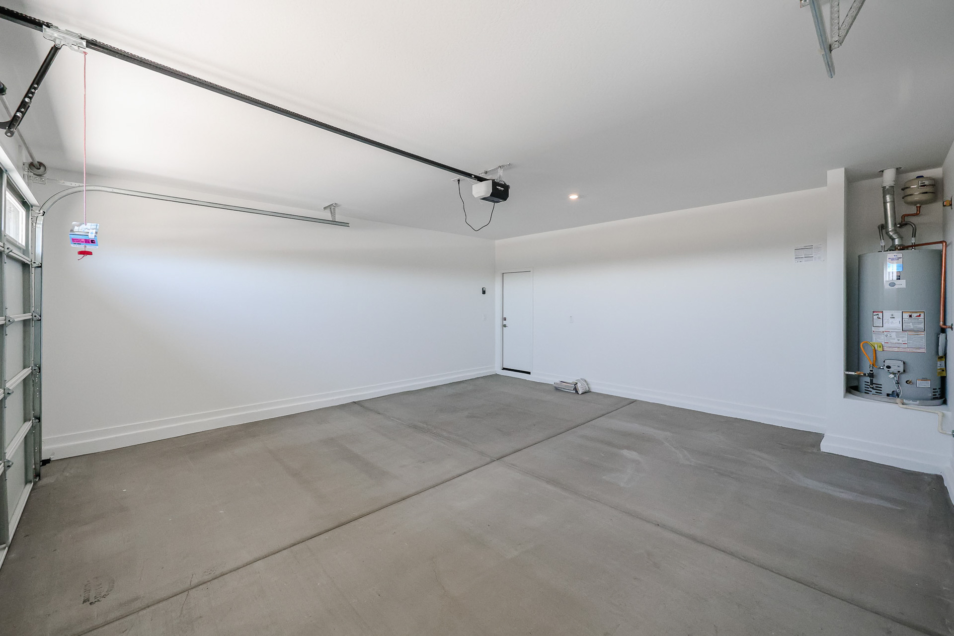 A room with a white wall and a white floor.