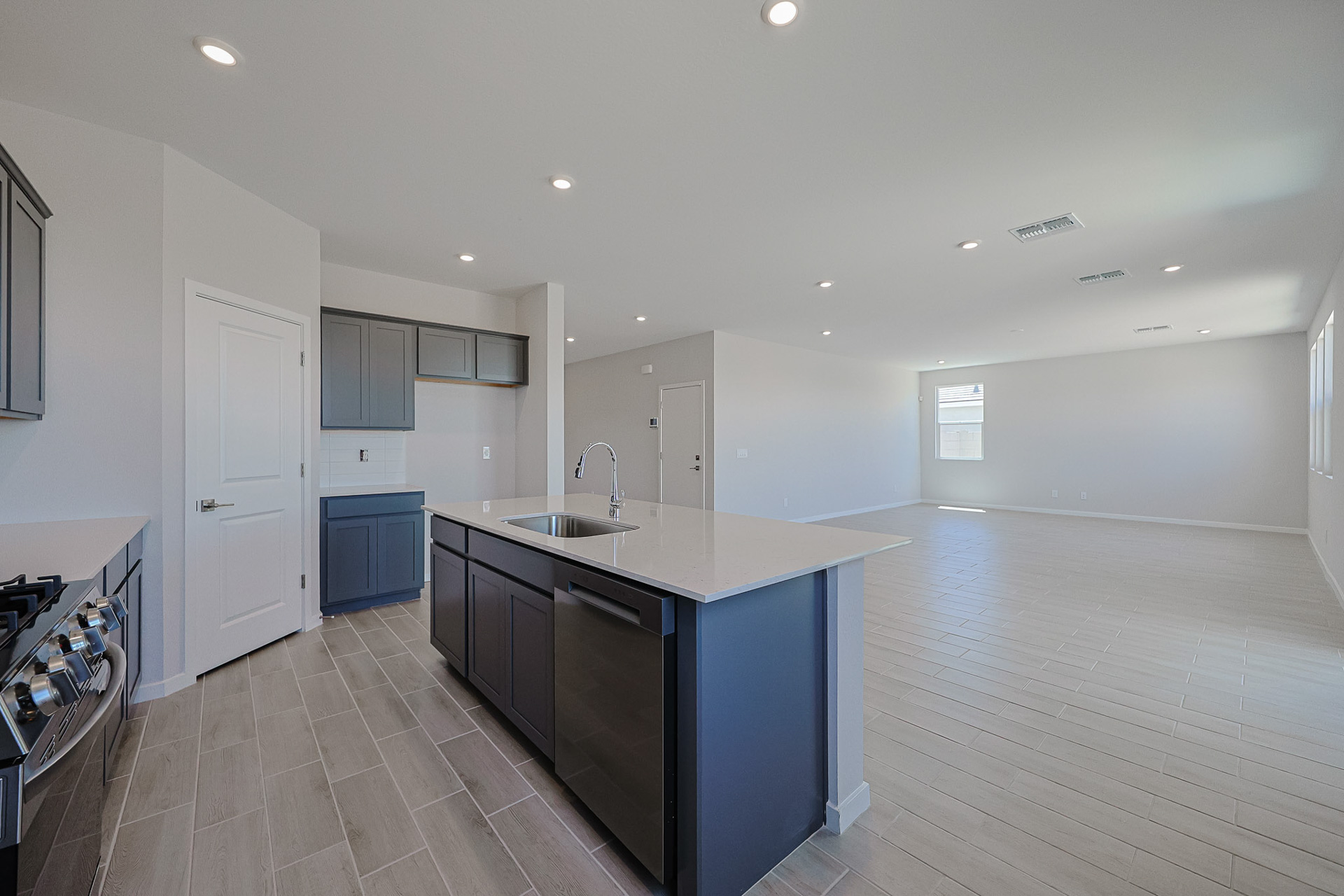 A kitchen with a marble countertop.