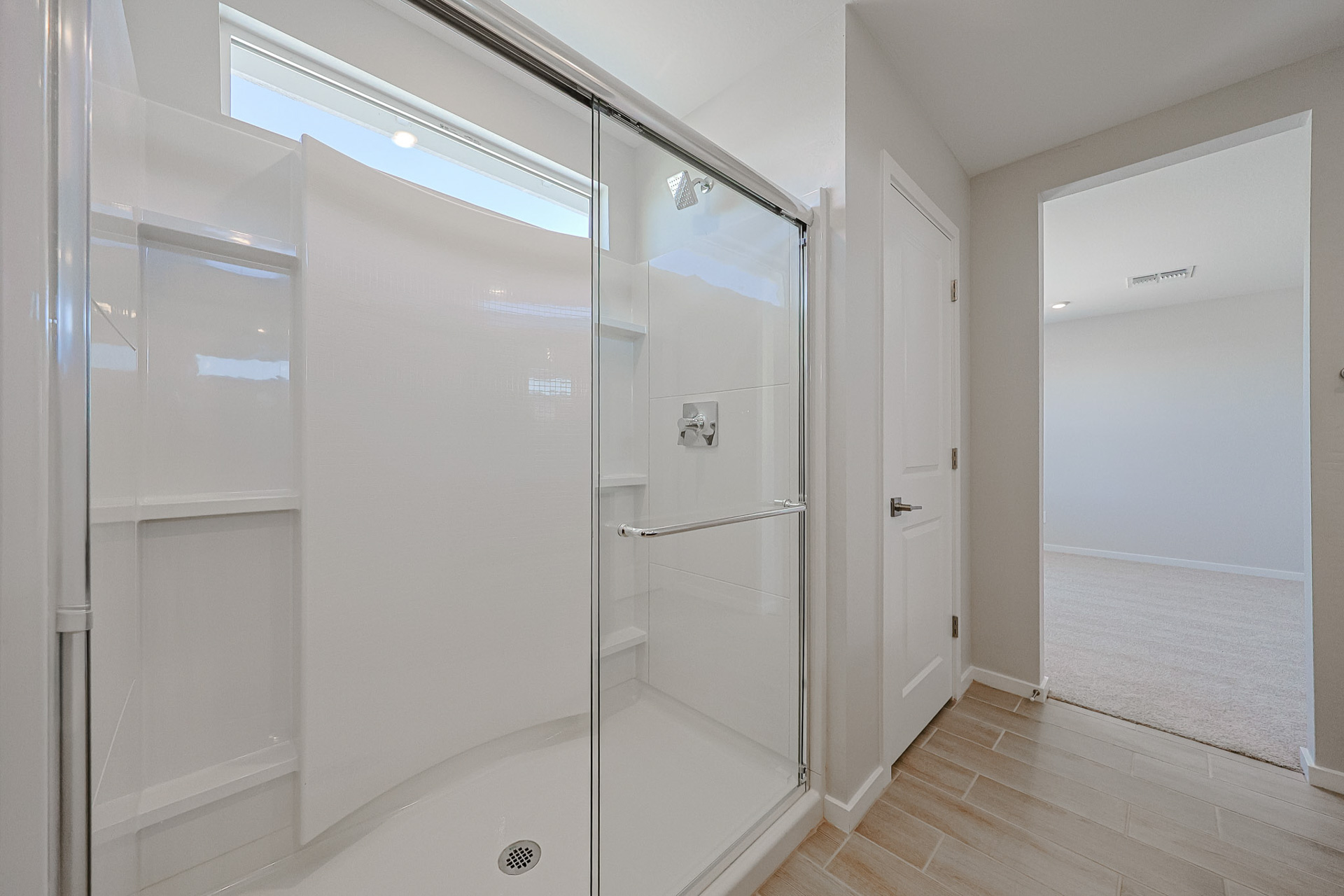A bathroom with a glass shower.