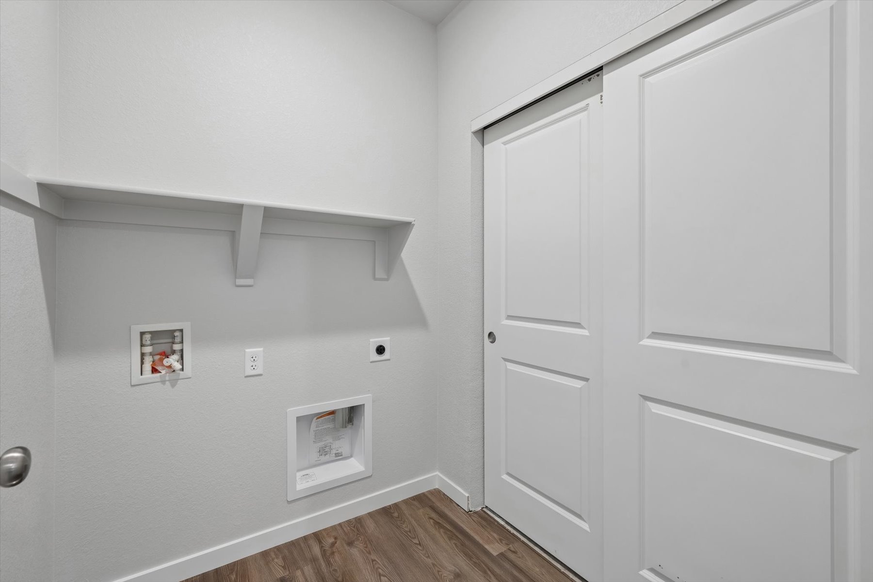 A white wall with white doors.