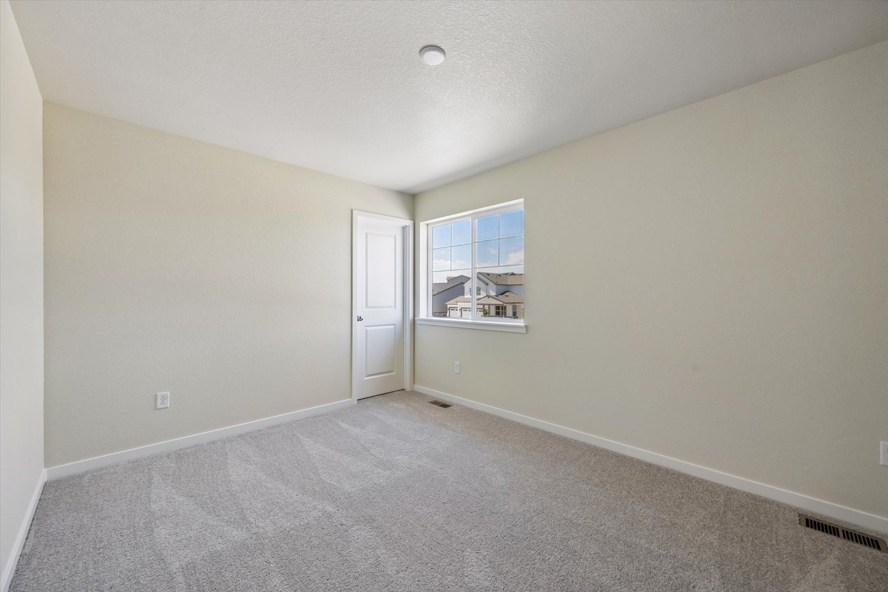 A room with a door and a window.