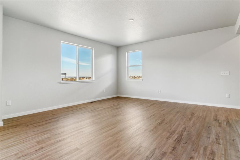 A room with a wood floor and a wood floor.