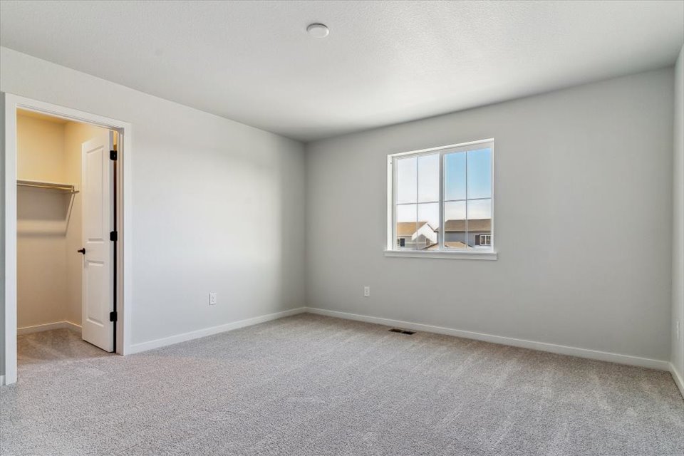 A room with a window and a door.