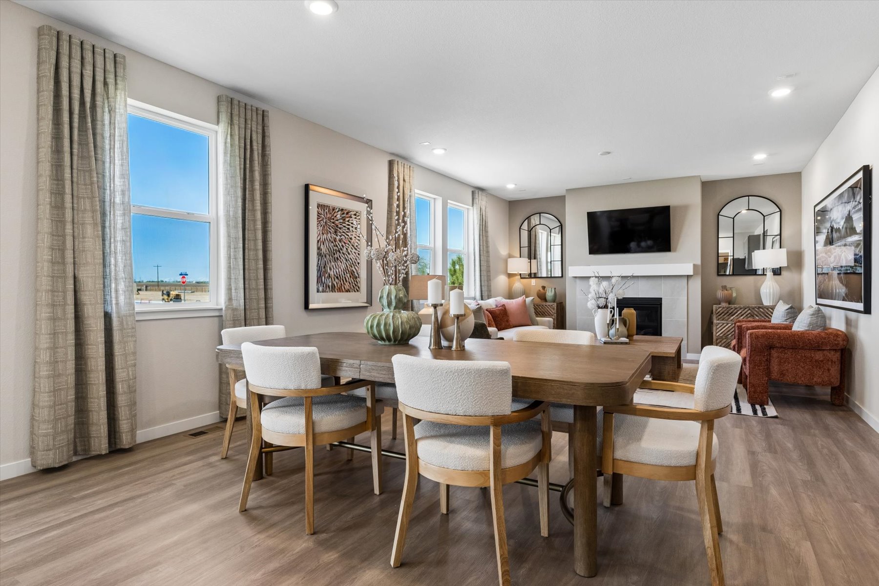 A dining room with a large table.