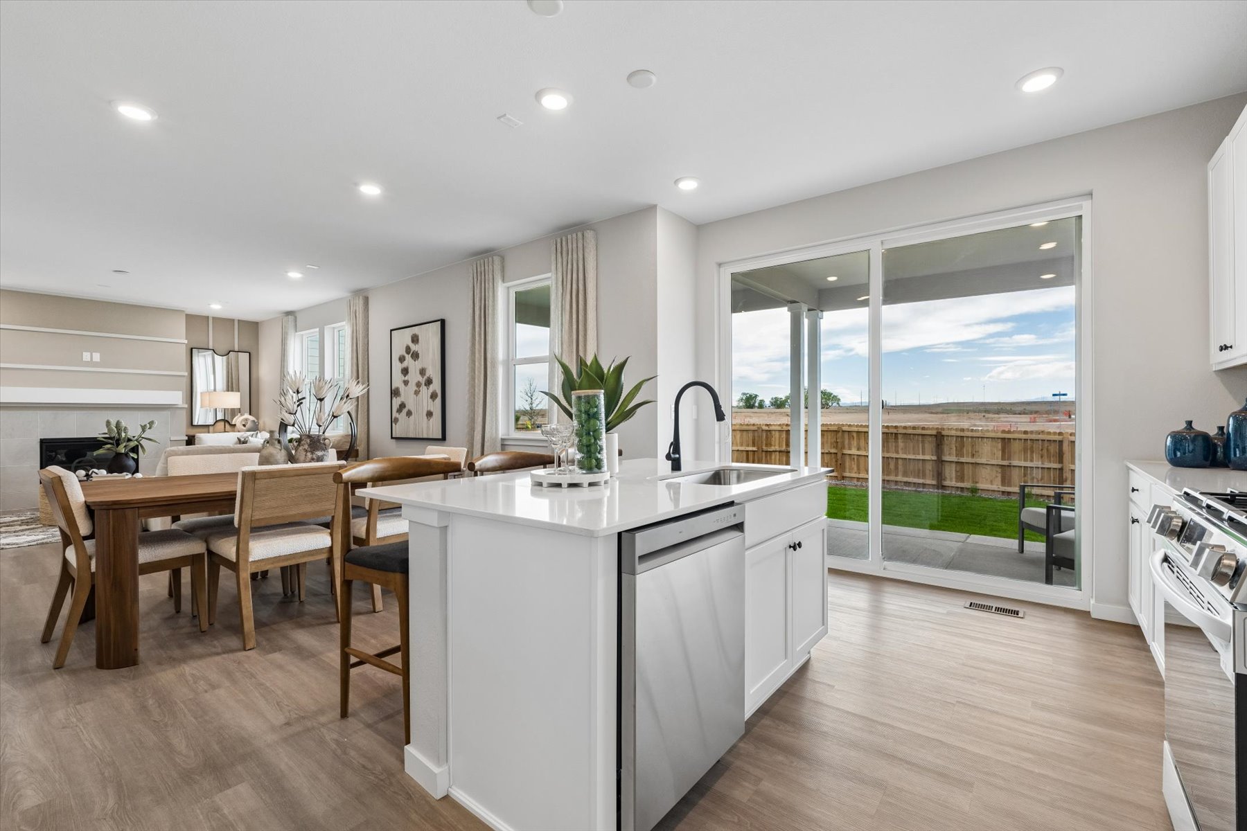 A kitchen with a large window.
