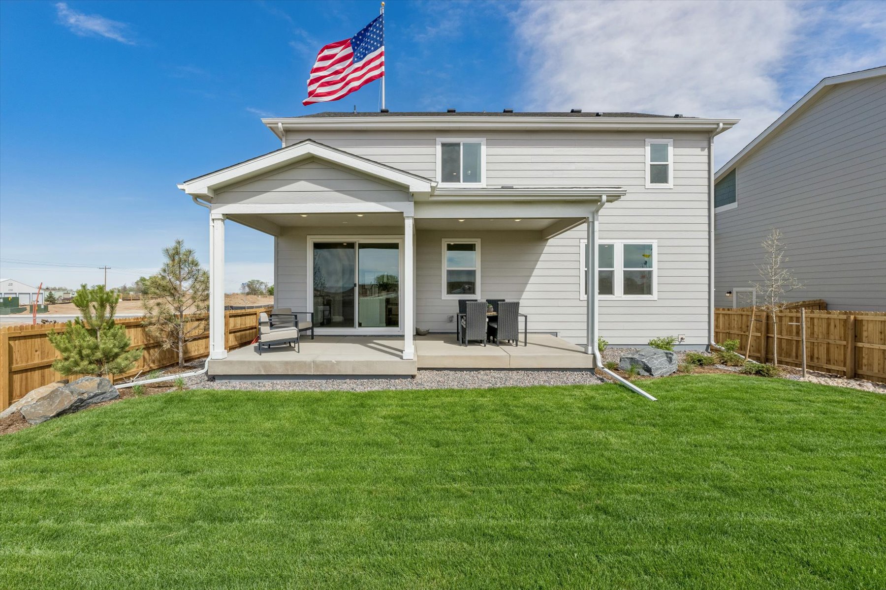 A house with a flag on the roof.