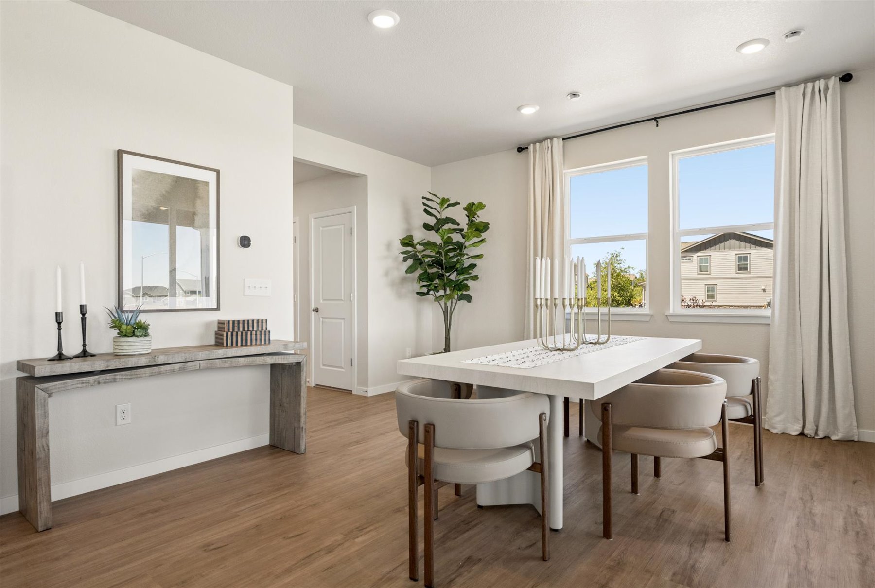 A room with a table and chairs.