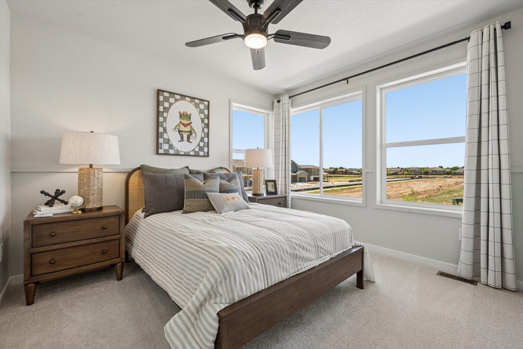 A bedroom with a bed and a window.