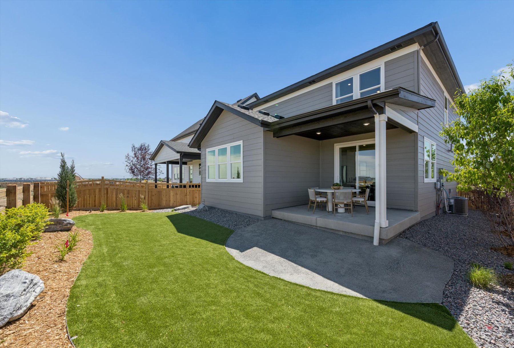 A house with a lawn and a fence.