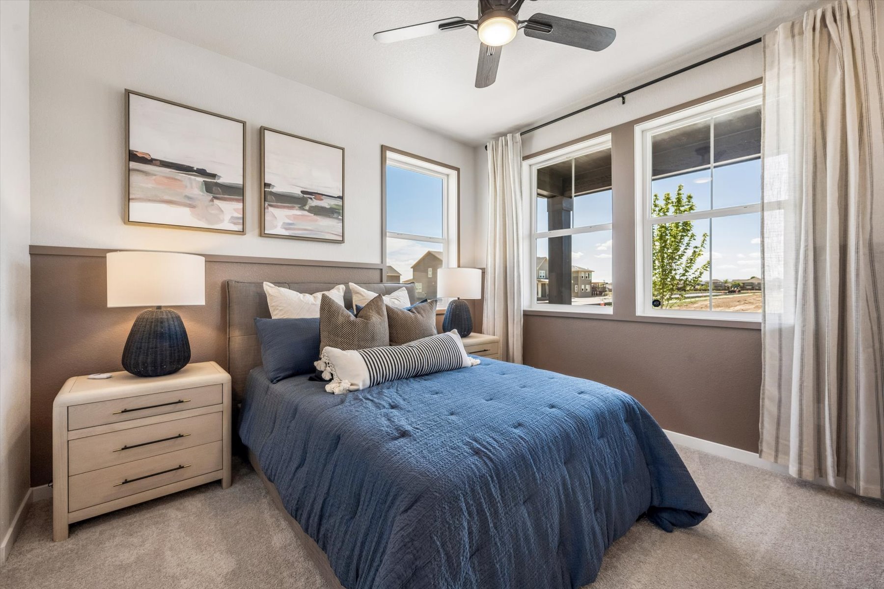 A bedroom with a bed and a window.