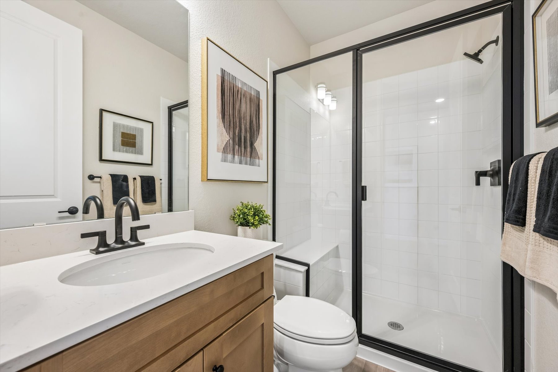 A bathroom with a glass shower.