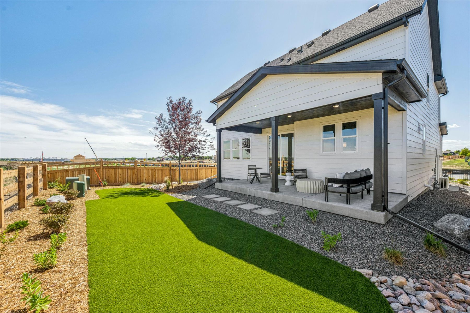 A house with a fence and a yard.