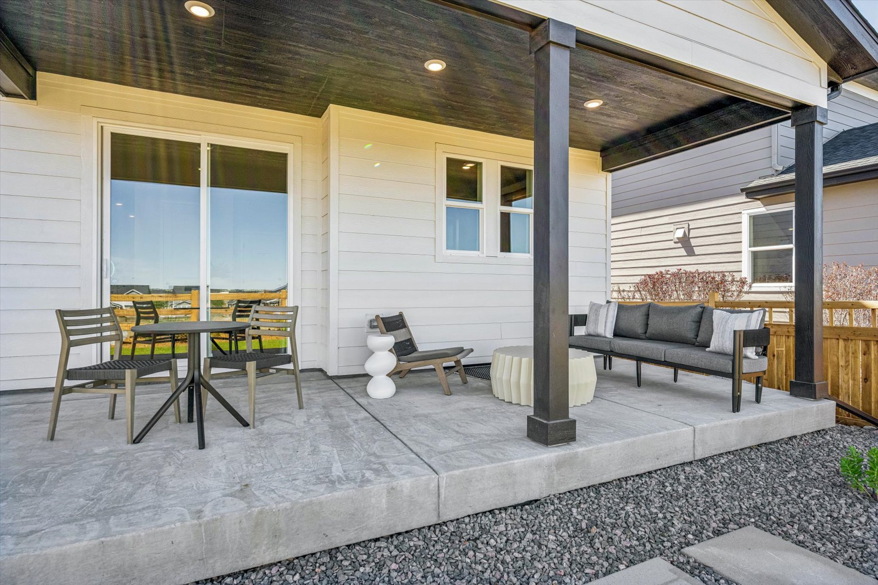 A patio with a table and chairs.