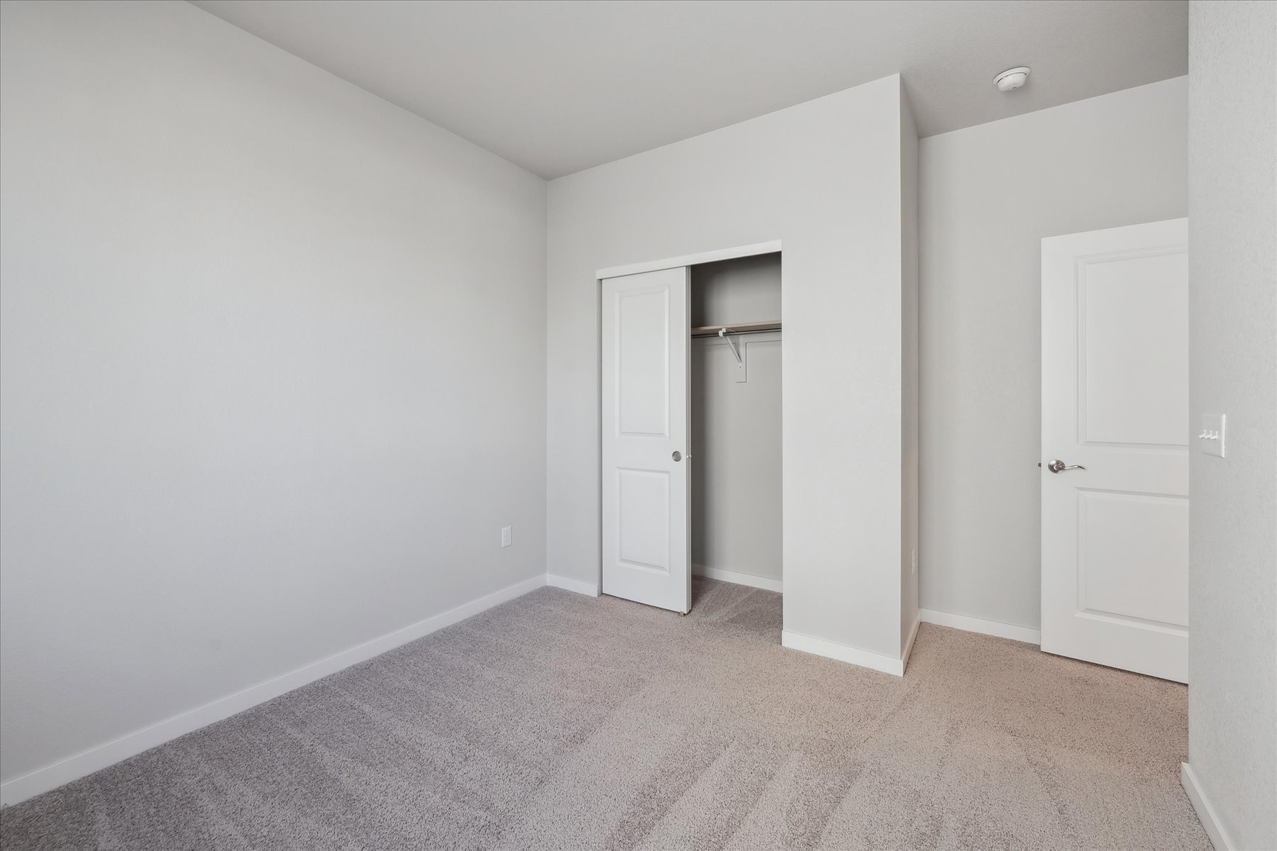 A room with white doors.