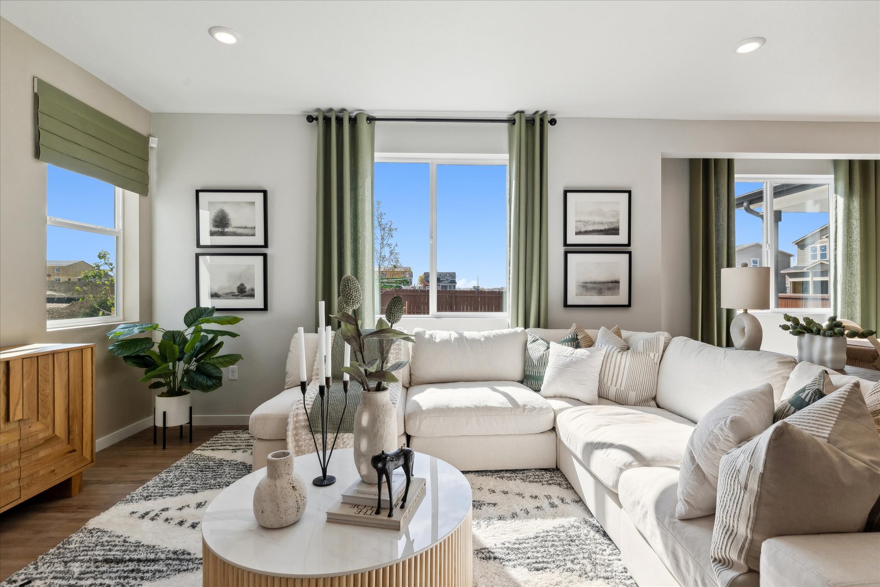 A living room with a couch and a table.