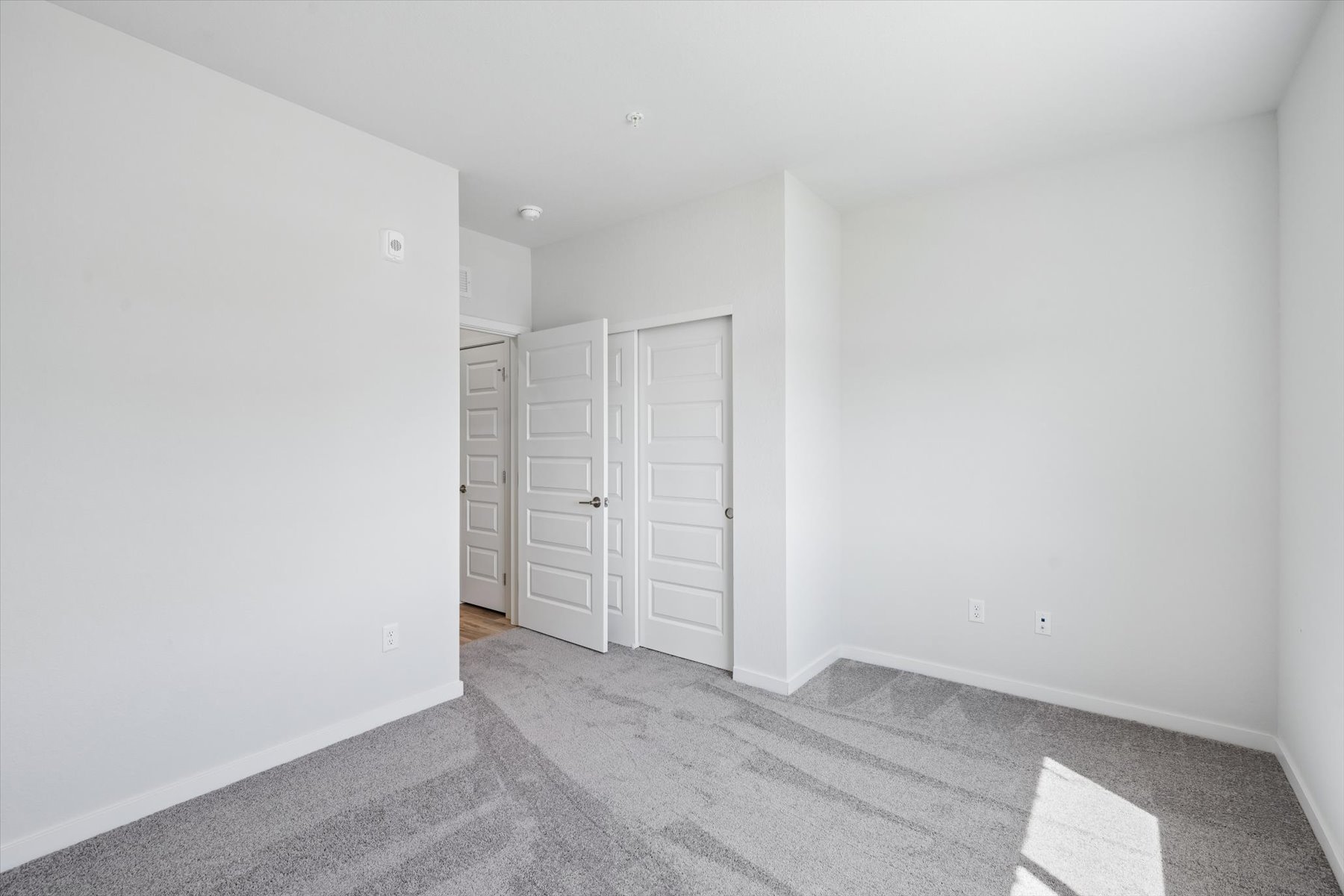A room with white cabinets.