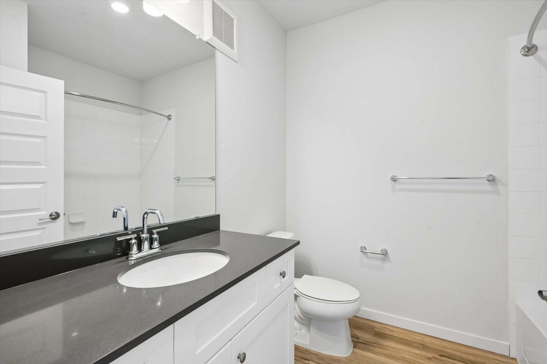 A bathroom with a sink and a toilet.