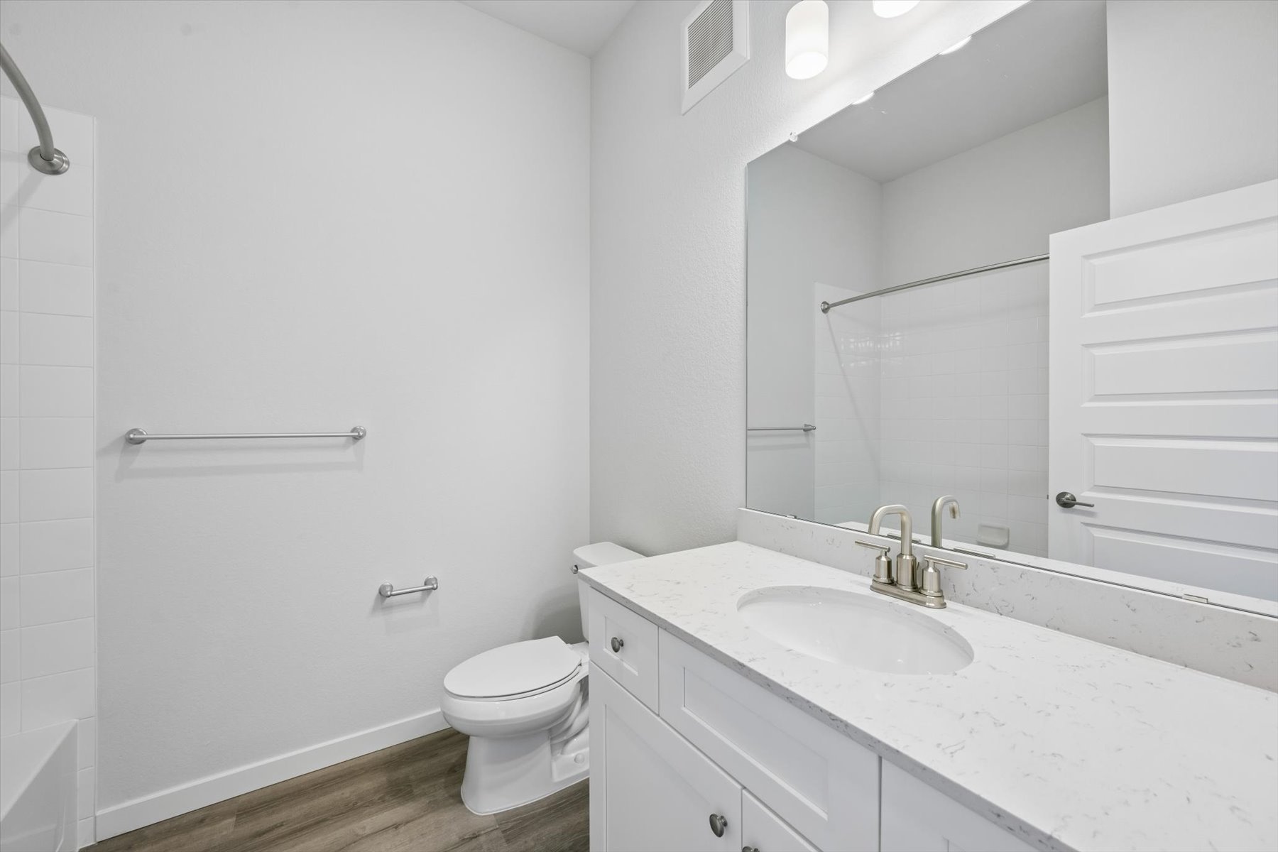 A bathroom with a sink toilet and shower.