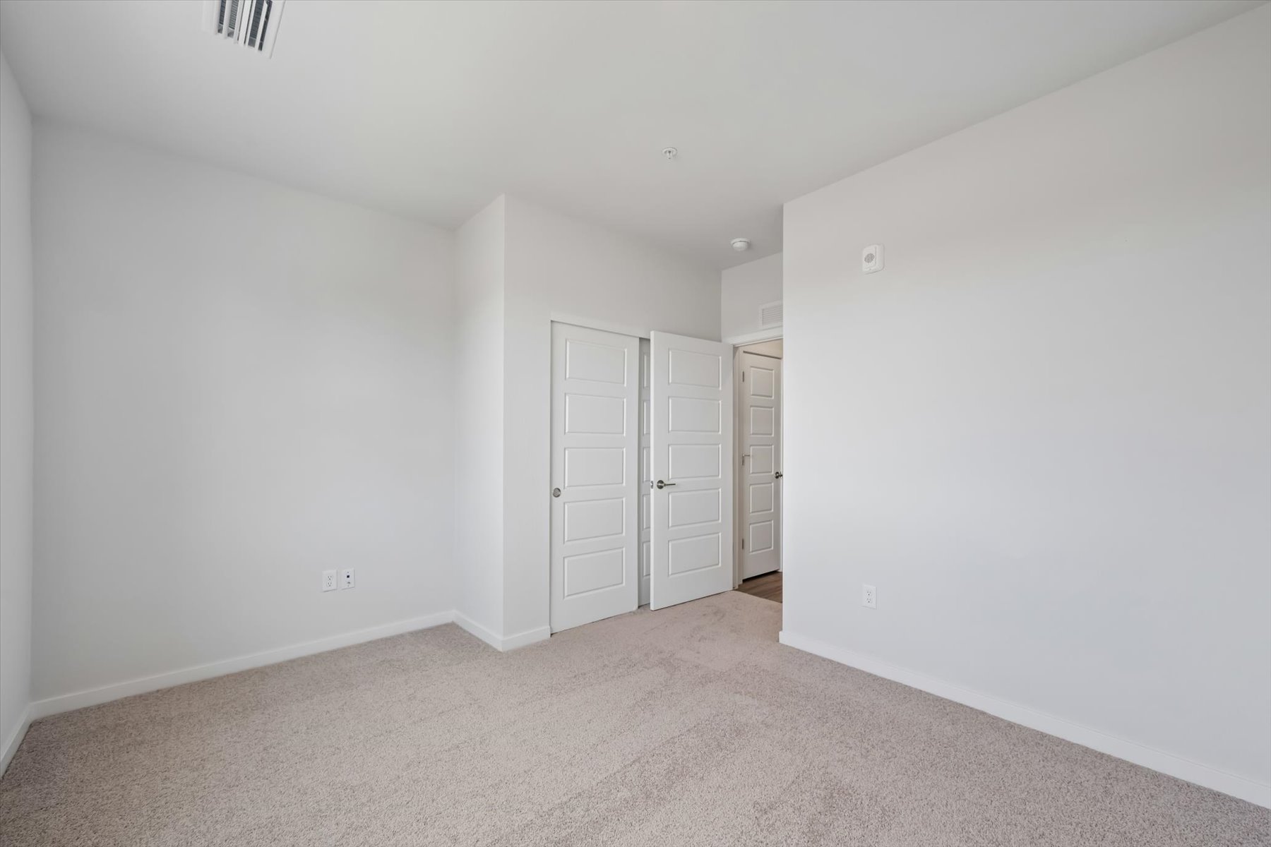 A room with white doors.