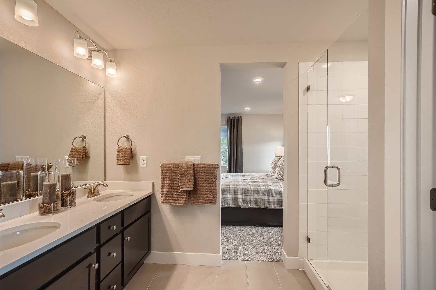A bathroom with a tub sink and a shower.