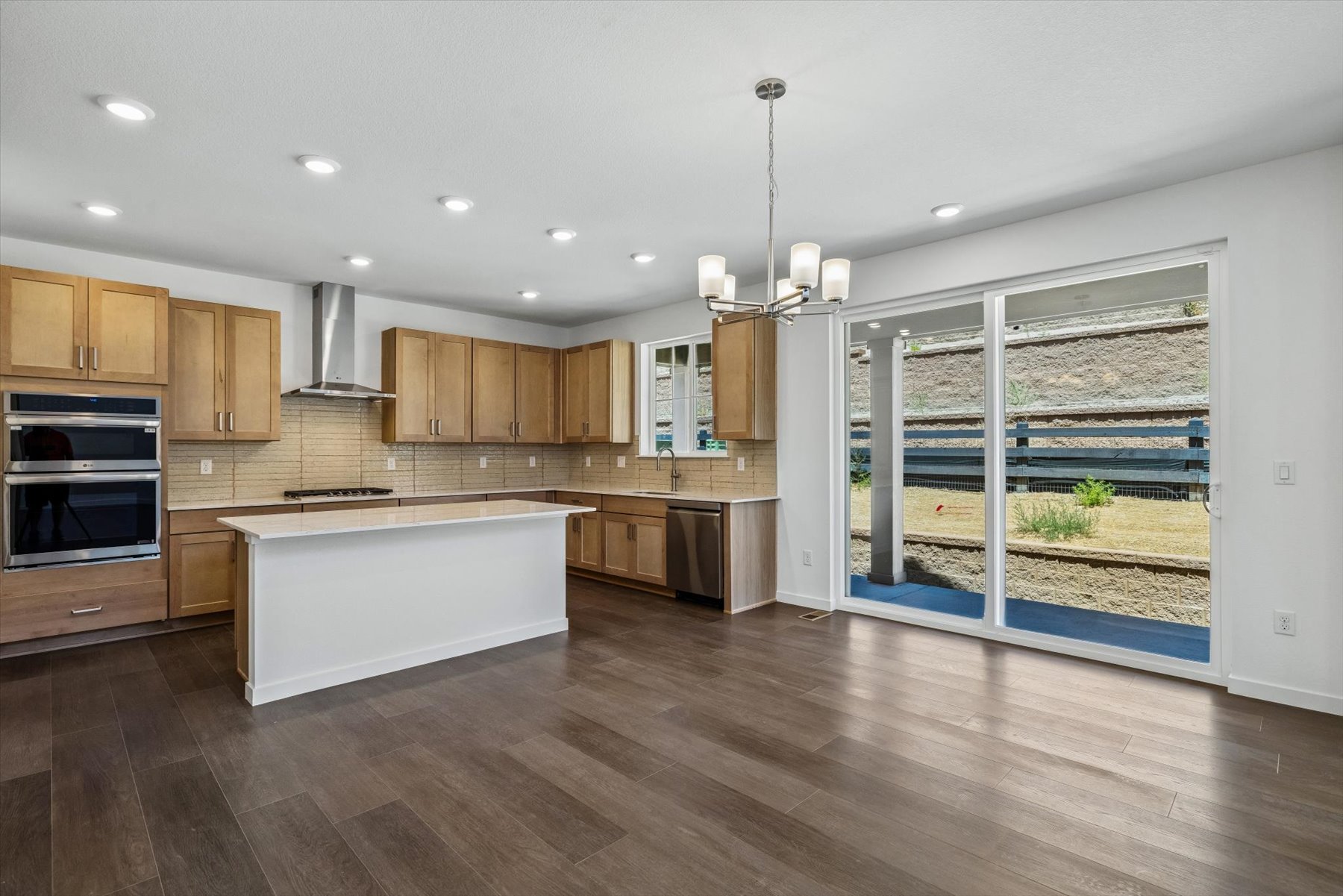 A kitchen with wooden cabinets.