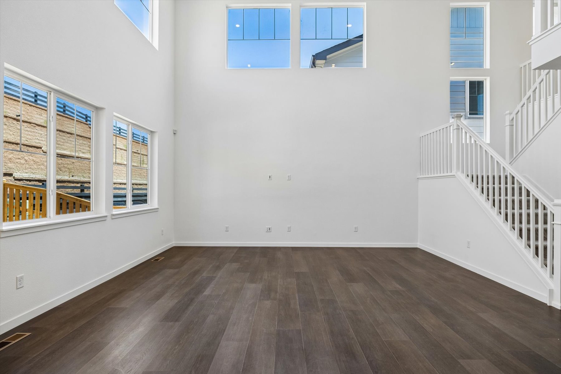 A room with white walls and windows.