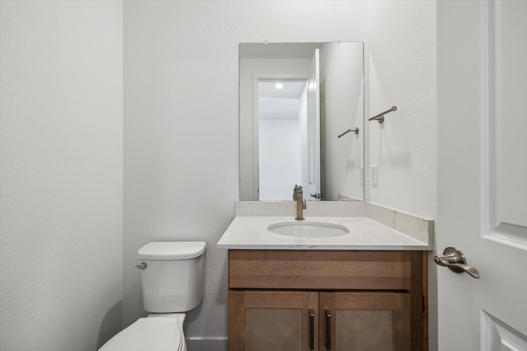 A bathroom with a sink and toilet.