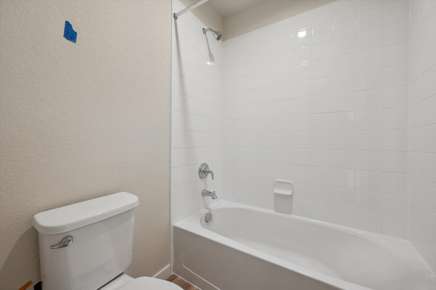 A bathroom with a bathtub toilet and toilet.