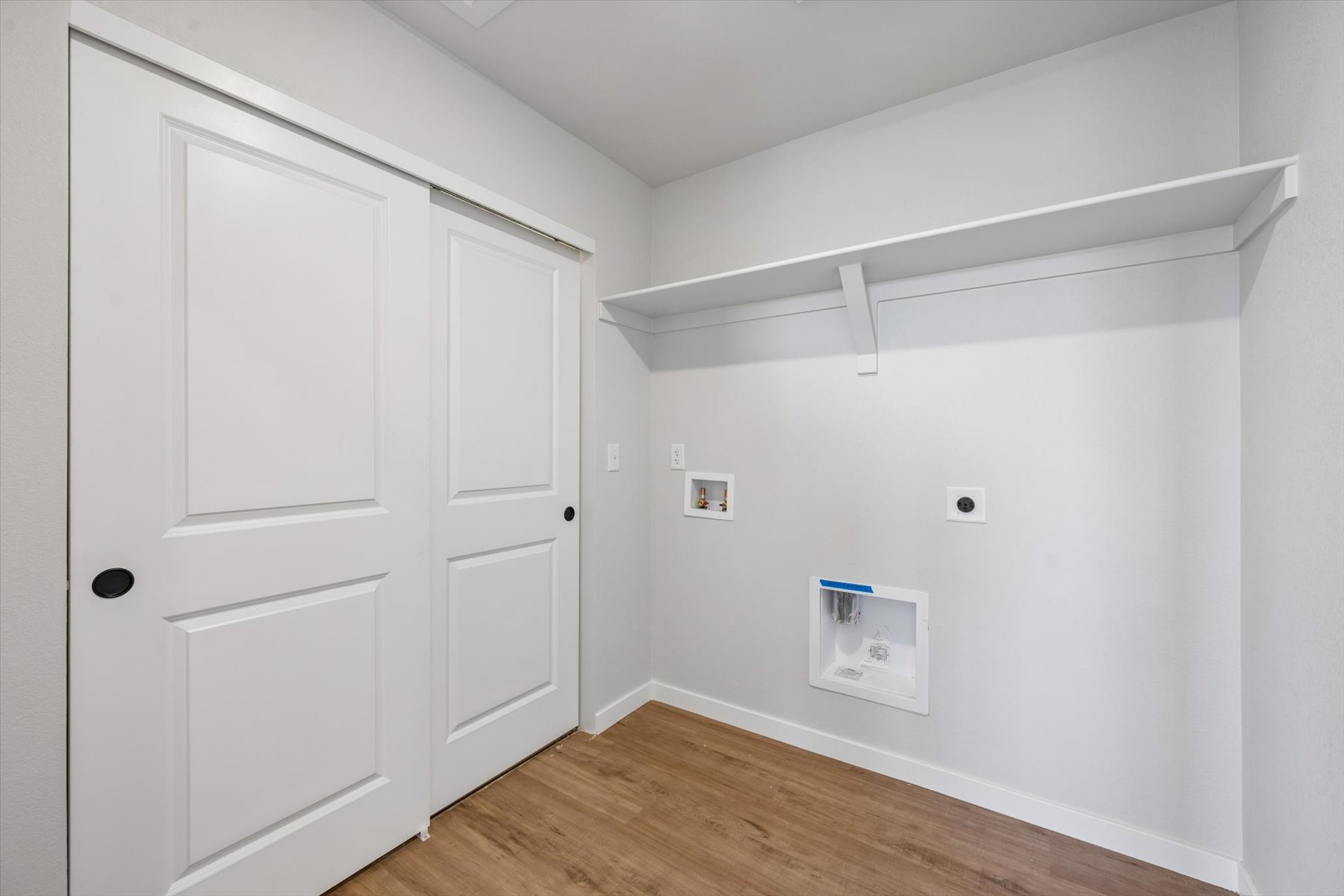 A room with white cabinets.