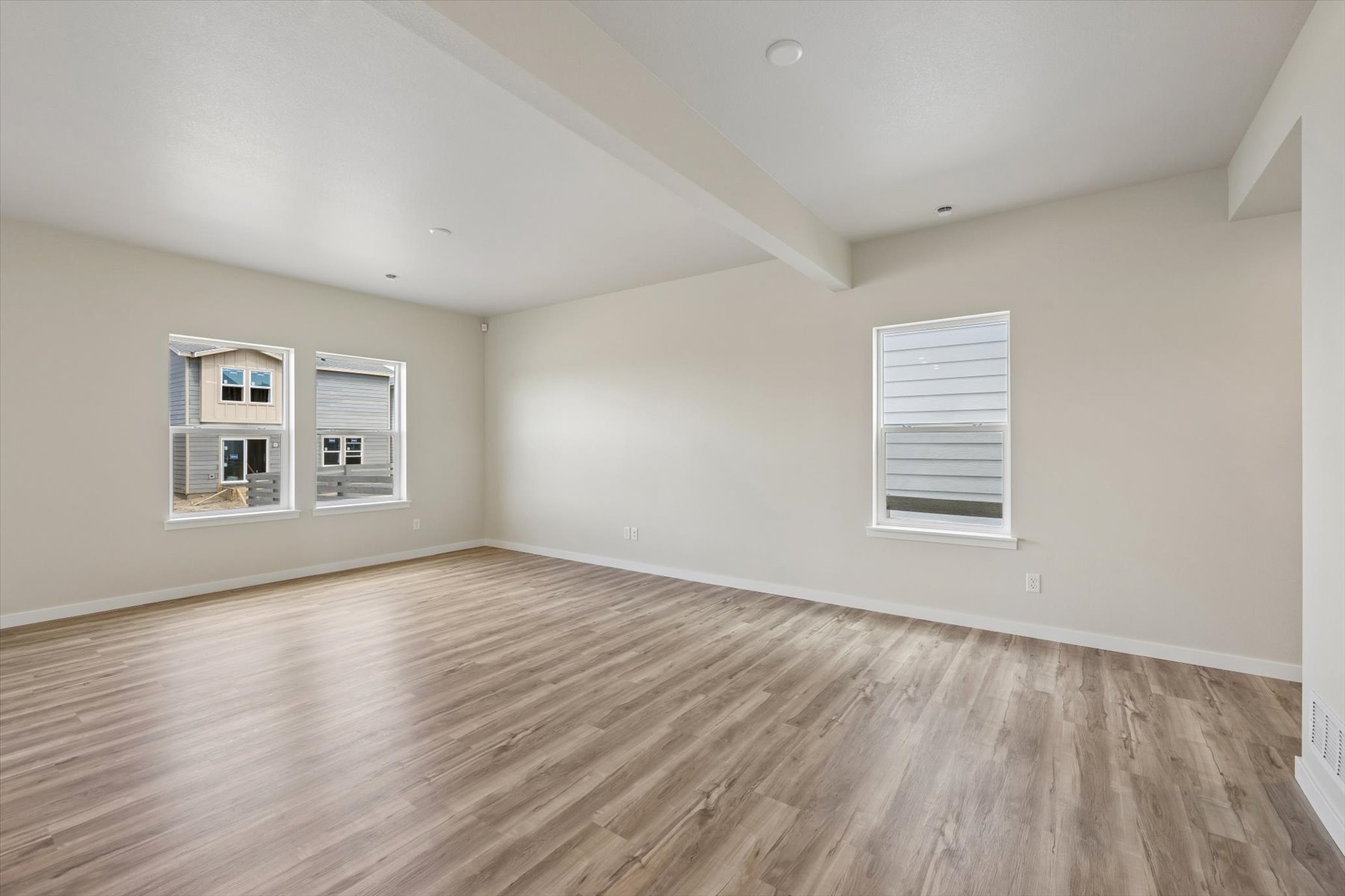 A room with a wood floor and a wood floor.