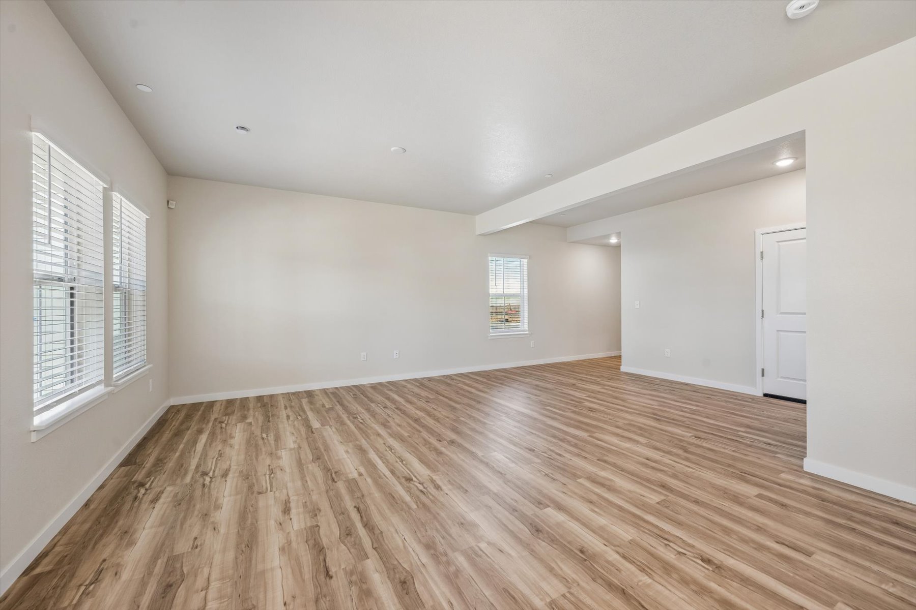 A room with a wood floor and a wood floor.