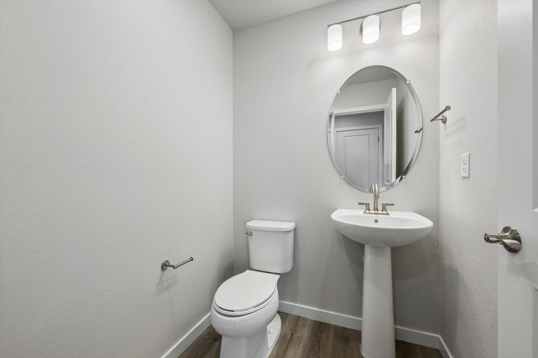 A bathroom with a sink and toilet.