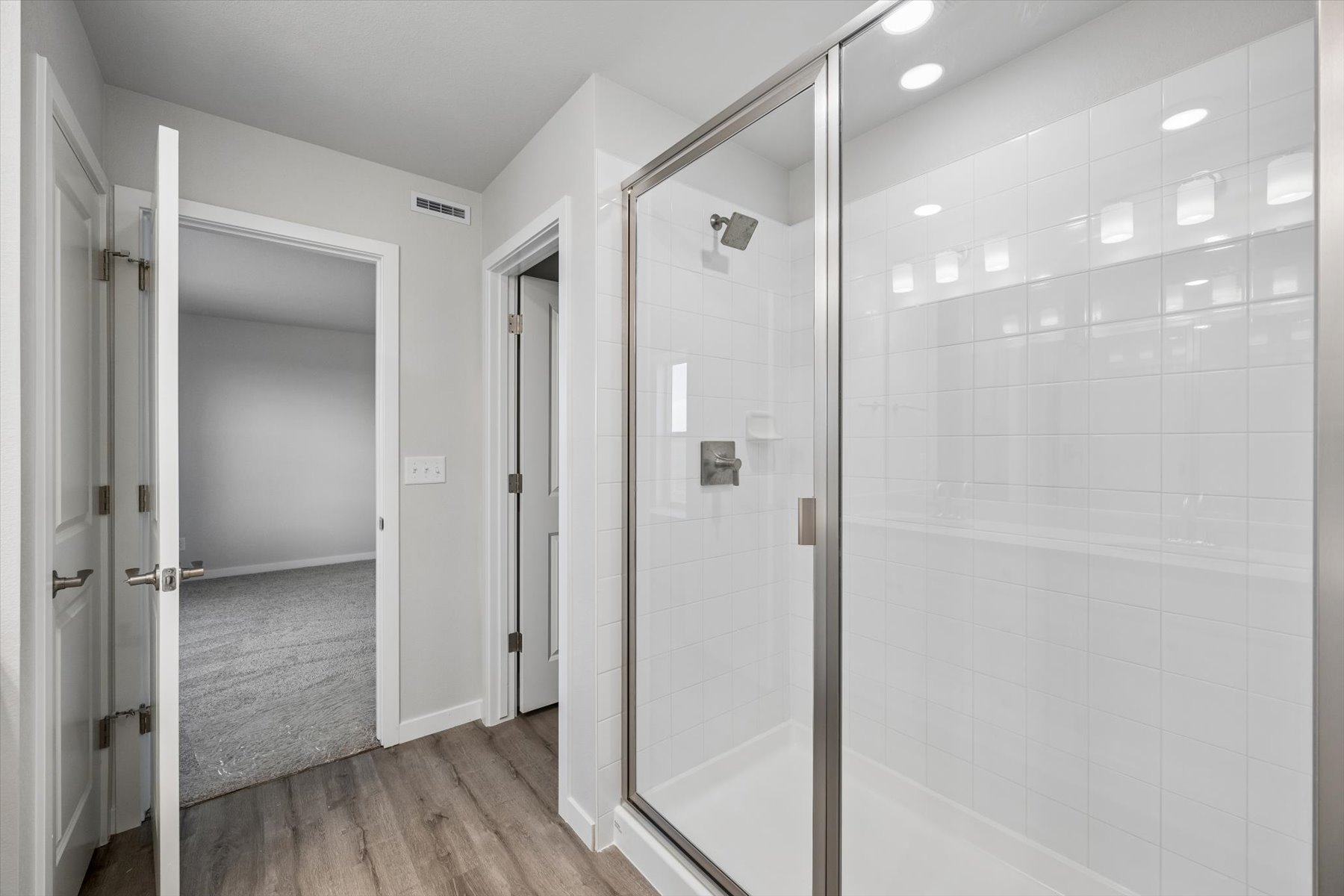 A bathroom with a glass shower.