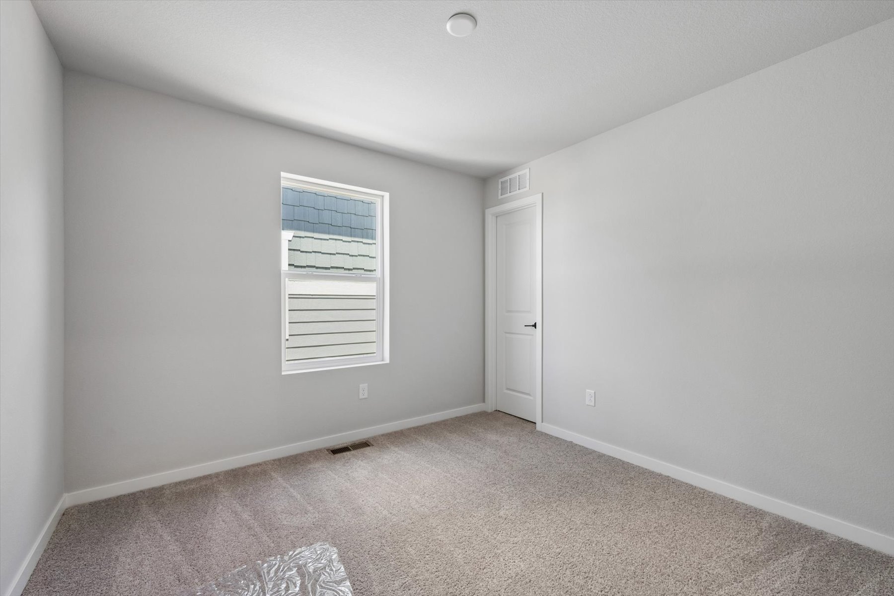 A room with a door and a window.