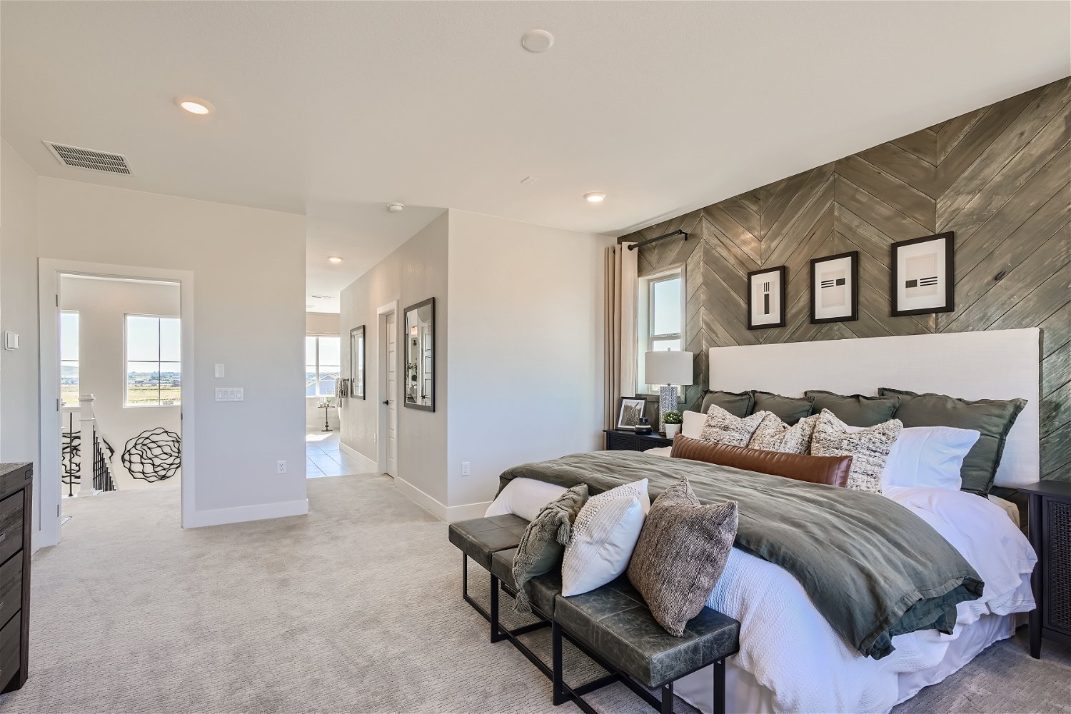 A bedroom with a bed and a couch.